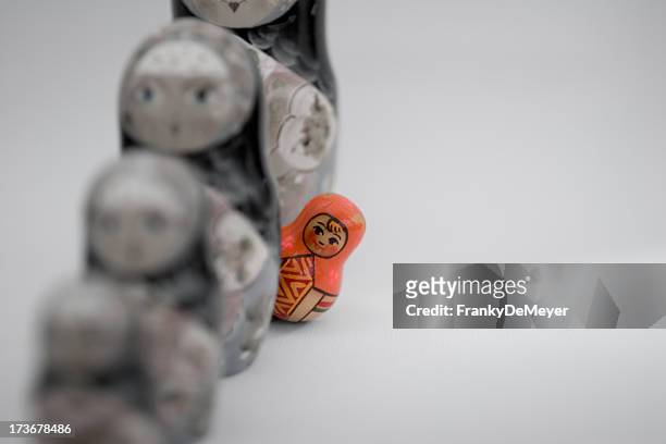 stand out from the crowd - russian nesting doll stock pictures, royalty-free photos & images