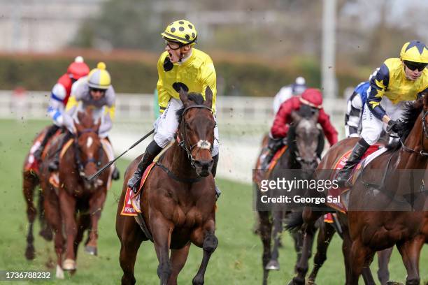 Without A Fight ridden by Mark Zahra wins the Carlton Draught Caulfield Cup at Caulfield Racecourse on October 21, 2023 in Caulfield, Australia.