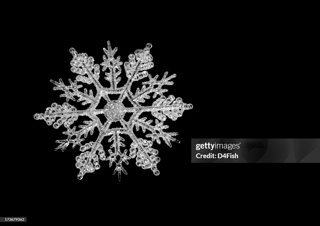 Icy snowflake on a black background