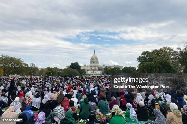 Hundreds of Muslim men hold a peace prayer at the National Mall near the U.S. Capitol in Washington, D.C., October 20 in support of an immediate...