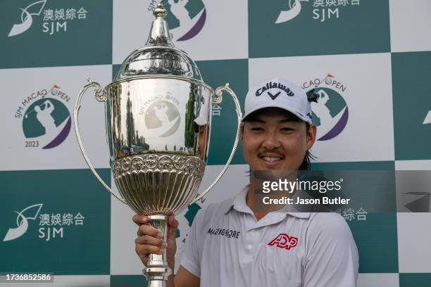 Min Woo Lee of Australia receives the trophy after winning the SJM Macao Open at Macau Golf and Country Club on October 15, 2023 in Macau, China.