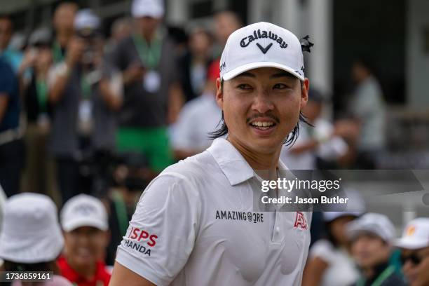 Min Woo Lee of Australia celebrates his win on hole 18 during the final round of the SJM Macao Open at Macau Golf and Country Club on October 15,...