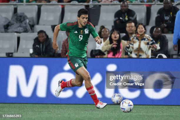 Raúl Jimenez of Mexico srives the ball during the friendly match between Ghana and Mexico at Bank of America Stadium on October 14, 2023 in...