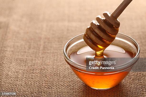 honey on burlap - honey jar stock pictures, royalty-free photos & images