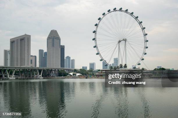 singapore flyer and city scenery - marina bay sands skypark stock pictures, royalty-free photos & images