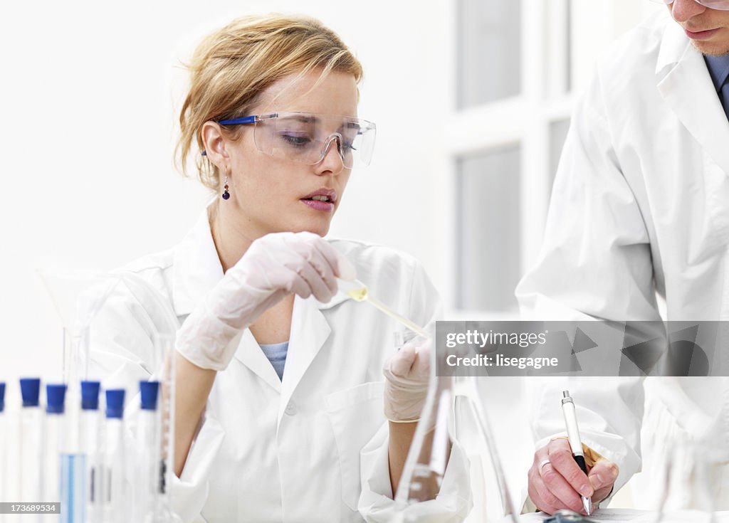 Researchers working with chemicals