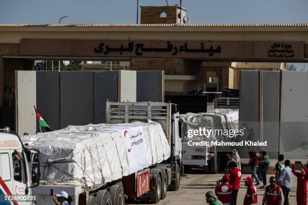 Aid convoy trucks cross the Rafah border from the Egyptian side on October 21, 2023 in North Sinai, Egypt. The aid convoy, organized by a group of...