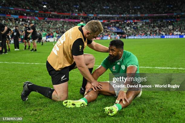 Sam Cane of New Zealand consoles Bundee Aki of Ireland at full-time following the Rugby World Cup France 2023 Quarter Final match between Ireland and...