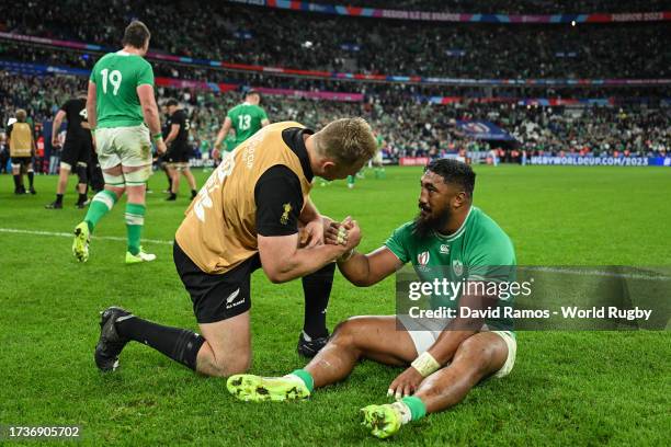 Sam Cane of New Zealand consoles Bundee Aki of Ireland at full-time following the Rugby World Cup France 2023 Quarter Final match between Ireland and...