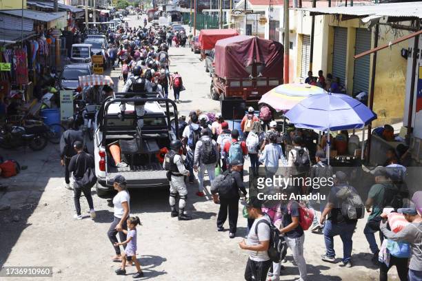 Hundreds of migrants enter Mexico from Guatemala, to advance towards the border with the United States, in Ciudad Hidalgo, Mexico, on October 20,...