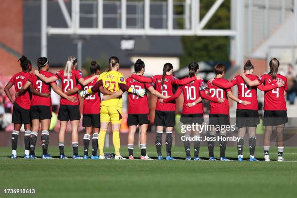 Players, fans and match officials observe a minutes silence in remembrance of the victims of last weekends attacks in Israel prior to the Barclays...