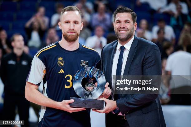 Dzanan Musa of Real Madrid receives from Felipe Reyes the MVP Of The Month before ACB League match between Real Madrid and UCAM Murcia at WiZink...