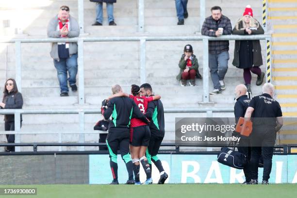 Gabrielle George of Manchester United receives medical treatment during the Barclays Women's Super League match between Manchester United and...