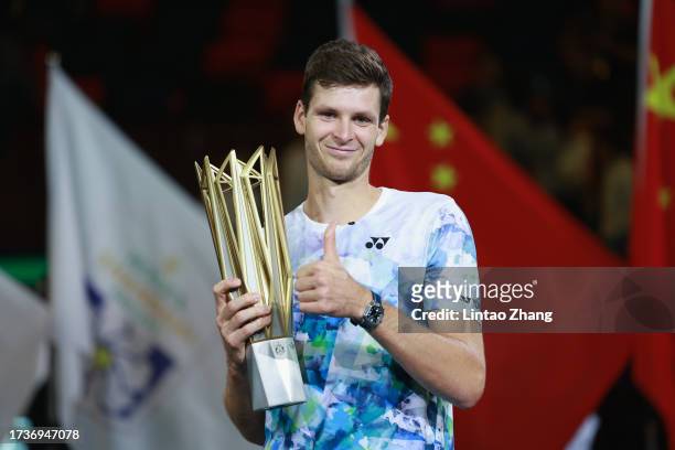 Hubert Hurkacz of Poland poses with the winner's trophy after defeating Andrey Rublev of Russia during the Men's singles final match on Day 14 of the...