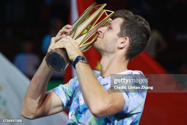 Hubert Hurkacz of Poland poses with the winner's trophy after defeating Andrey Rublev of Russia during the Men's singles final match on Day 14 of the...