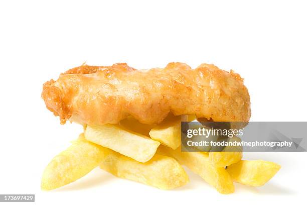 battered piece of fish on top of hot chips - deep fried stock pictures, royalty-free photos & images