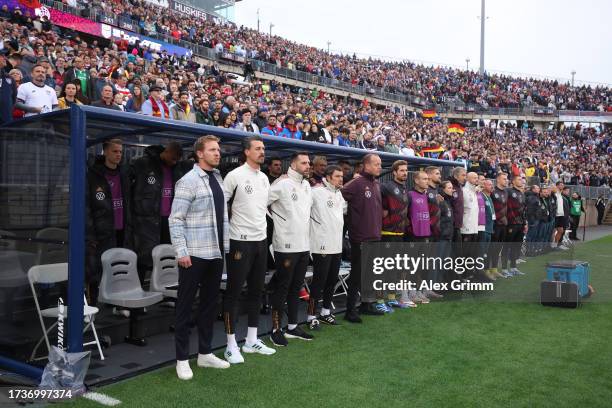 The German team observes a minute's silence prior to the international friendly match between Germany and United States at Pratt & Whitney Stadium on...