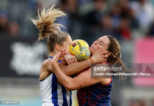 Alice O'Loughlin of the Kangaroos and Maeve Chaplin of the Demons in action during the 2023 AFLW Round 08 match between Narrm and The North Melbourne...
