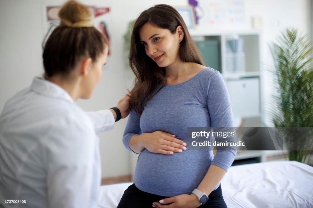 Shot of a pregnant woman having a consultation with a doctor