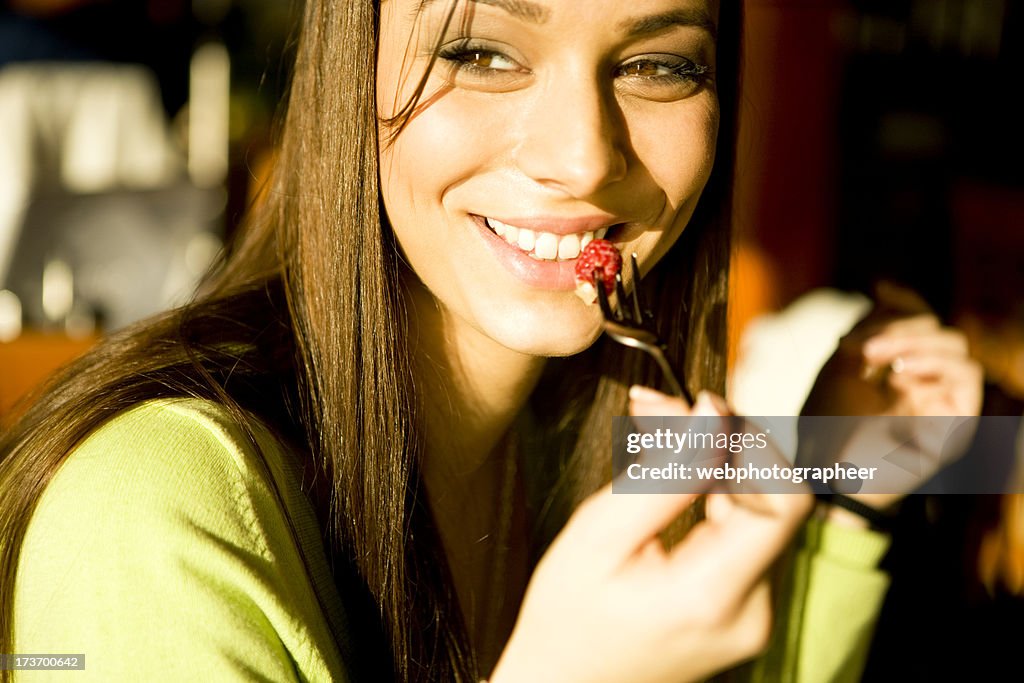 Woman Eating Raspberry