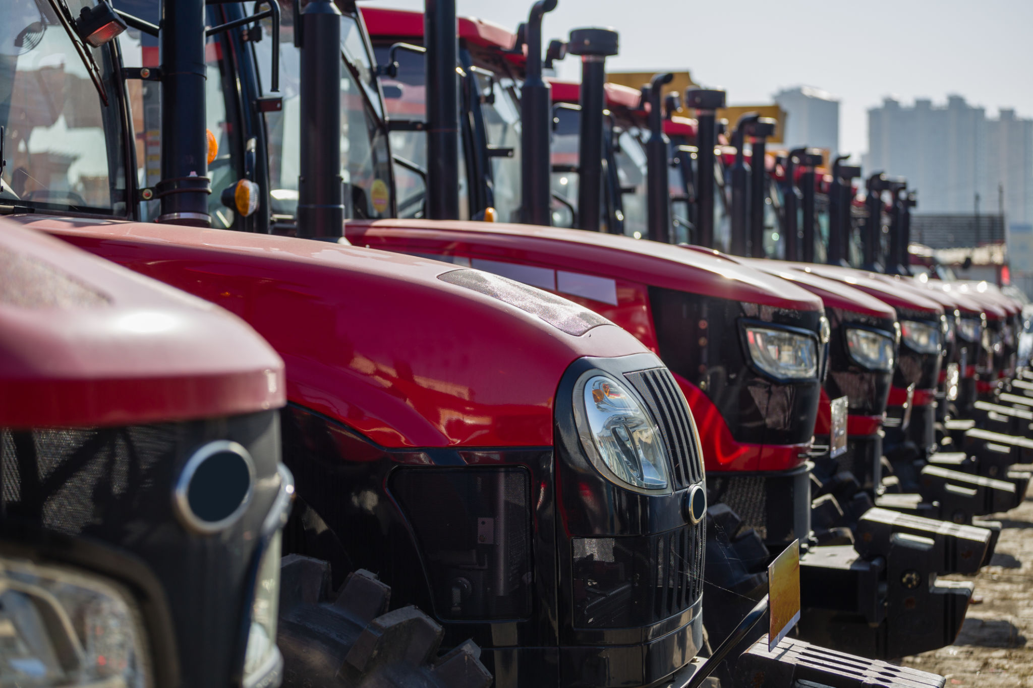 Red tractors in a row Red tractors in a row