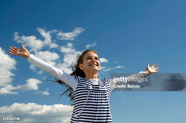 happy young girl - arms raised to sky stock pictures, royalty-free photos & images