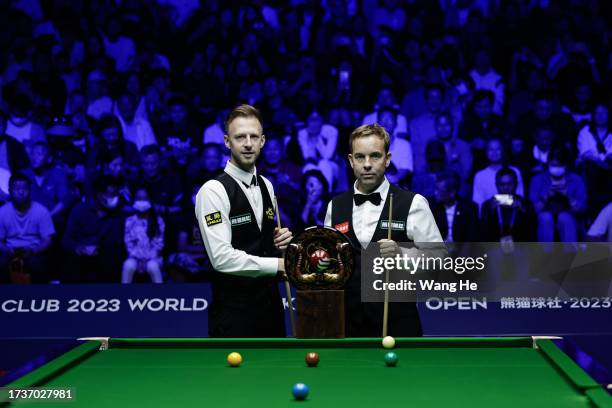 Judd Trump of England poses take pictures in the final match against Ali Carter of England on Day 7 of World Snooker Wuhan open 2023 at Wuhan Stadium...