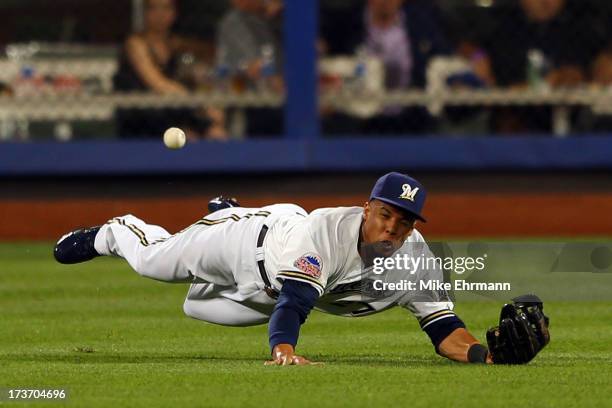 National League All-Star Carlos Gonzalez of the Colorado Rockies fails to make a play on a ball hit by American League All-Star Prince Fielder of the...