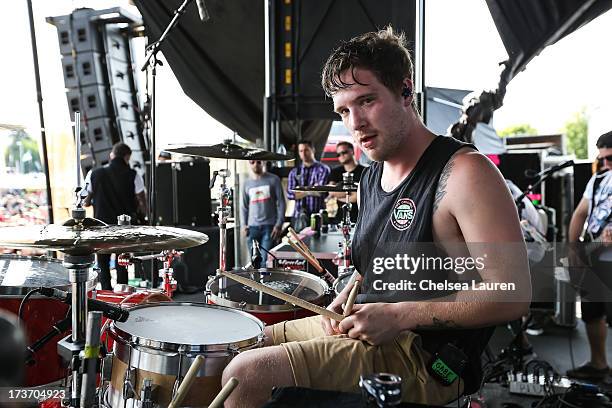 Drummer Gabe Barham of Sleeping With Sirens performs at the Vans Warped Tour on June 16, 2013 in Portland, Oregon.