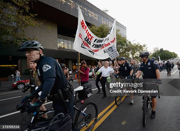 Demonstrators march in the streets of Downtown Los Angeles against the acquittal of George Zimmerman in the shooting death of Florida teen Trayvon...