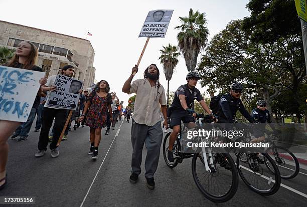 Demonstrators march in the streets of Downtown Los Angeles against the acquittal of George Zimmerman in the shooting death of Florida teen Trayvon...