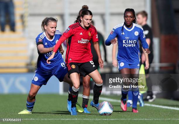 Hannah Blundell of Manchester United is challenged by Lena Petermann of Leicester City during the Barclays Women's Super League match between...
