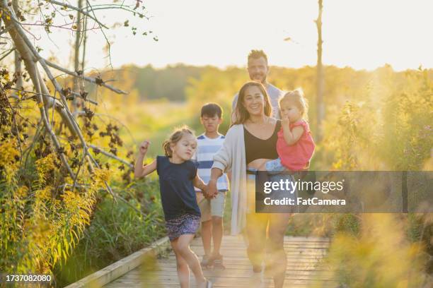 family fall walks - man walking towards camera on white stock pictures, royalty-free photos & images