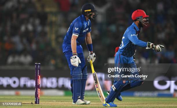 Joe Root of England is bowled by Mujeeb ur Rahman of Afghanistan during the ICC Men's Cricket World Cup India 2023 between England and Afghanistan at...