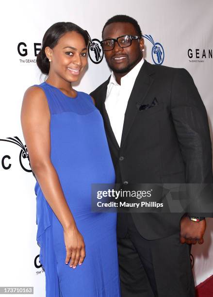 Player LeRon McClain and Dominque Wade arrive at The GEANCO Foundation's "Impact Africa" Fundraiser at Bootsy Bellows on July 16, 2013 in West...