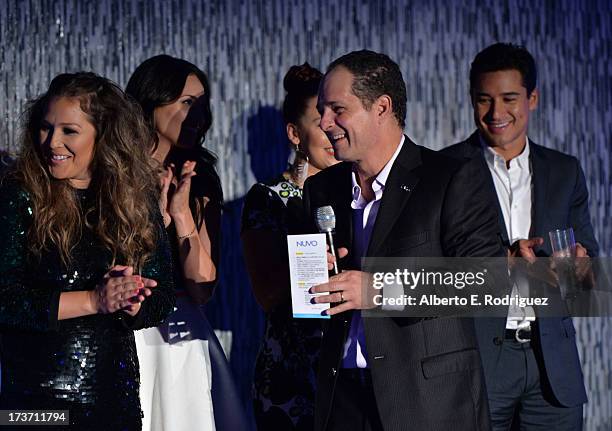 Singer Joy Enriquez and NUVOtv Chief Executive Officer Michael Schwimmer speak onstage at the NUVOtv Network Launch Party at The London West...