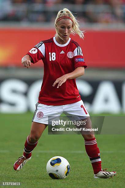 Theresa Nielsen of Denmark runs with the ball during the UEFA Women's EURO 2013 Group A match between Denmark and Finland at Gamla Ullevi Stadium on...