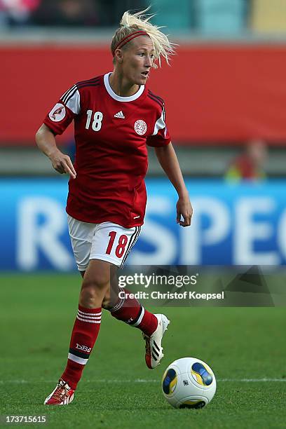 Theresa Nielsen of Denmark runs with the ball during the UEFA Women's EURO 2013 Group A match between Denmark and Finland at Gamla Ullevi Stadium on...