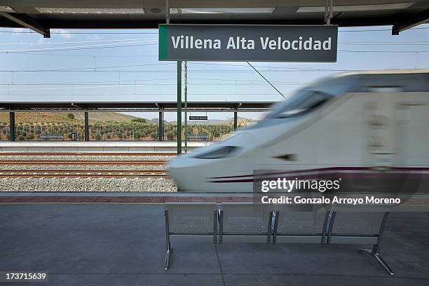 An AVE, the Spanish high speed train, leaves the Villena station towards Madrid on July 11, 2013 in Villena, Spain. The AVE Madrid-Alicante...