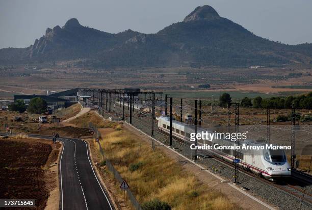 An AVE, the Spanish high speed train, leaves the station towards Madrid on July 11, 2013 in Villena, Spain. The AVE Madrid-Alicante high-speed train...
