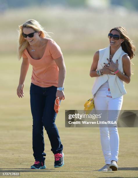 Tiger Woods' girlfriend Lindsey Vonn walks with Fred Couples' girlfriend Nadine Moze looks on ahead of the 142nd Open Championship at Muirfield on...