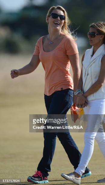 Tiger Woods' girlfriend Lindsey Vonn walks with Fred Couples' girlfriend Nadine Moze looks on ahead of the 142nd Open Championship at Muirfield on...