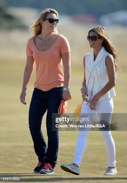 Tiger Woods' girlfriend Lindsey Vonn walks with Fred Couples' girlfriend Nadine Moze looks on ahead of the 142nd Open Championship at Muirfield on...