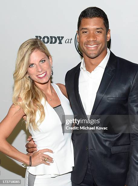 Professional football player Russell Wilson and Ashton Meem attend ESPN the Magazine 5th annual "Body Issue" party at Lure on July 16, 2013 in...