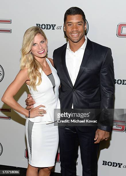 Professional football player Russell Wilson and Ashton Meem attend ESPN the Magazine 5th annual "Body Issue" party at Lure on July 16, 2013 in...
