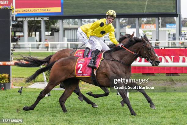 Without A Fight ridden by Mark Zahra wins the Carlton Draught Caulfield Cup at Caulfield Racecourse on October 21, 2023 in Caulfield, Australia.