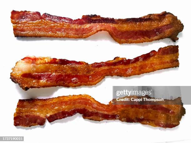 bacon isolated on white background - spek stockfoto's en -beelden