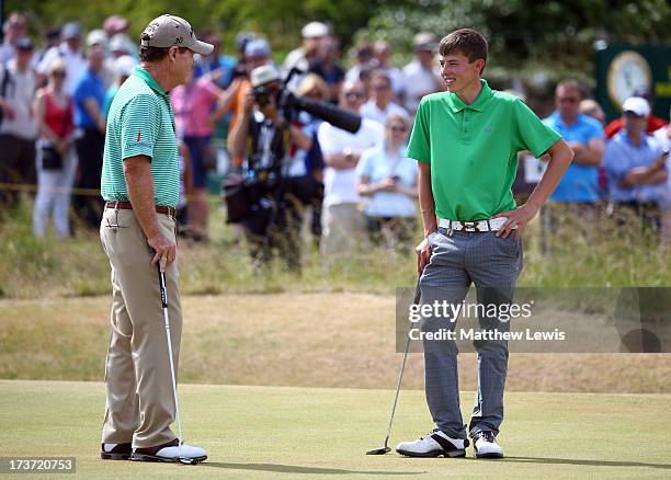 Tom Watson of the United States talks with Matthew Fitzpatrick of England ahead of the 142nd Open Championship at Muirfield on July 17, 2013 in...