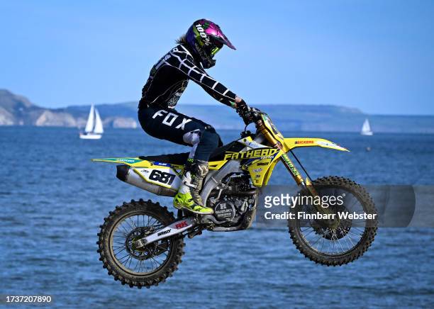 Motocross riders compete on the beach on October 15, 2023 in Weymouth, United Kingdom. The motocross event, which first came to the town in 1984,...