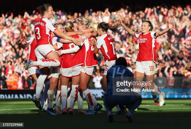 Alessia Russo of Arsenal celebrates with teammates after scoring the team's second goal during the Barclays Women's Super League match between...